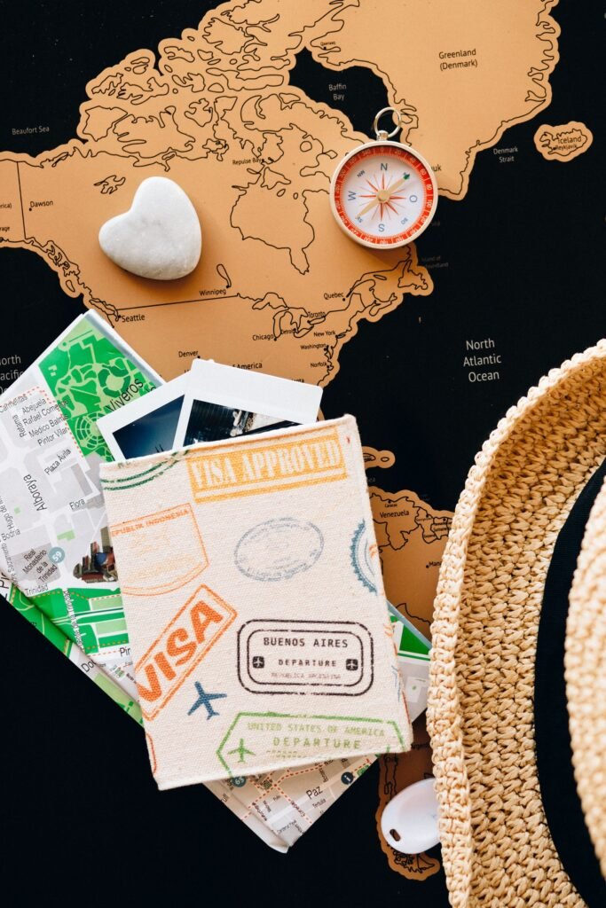 Passport, compass and world map for international patient travel planning
