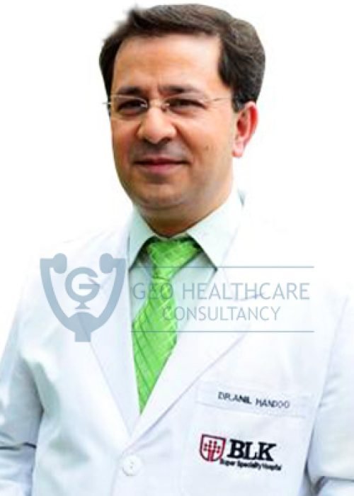 Male doctor with a mustache, wearing glasses and a white coat
